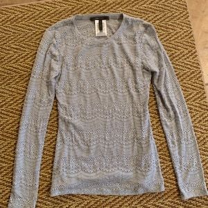 Light blue sweater with intricate hole details